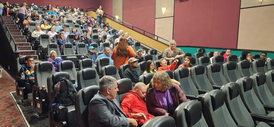 People begin to fill up the rented theater for the opening of “Champions” Friday evening, March 10, 2023, at Regal Cinema at Franklin Square. 