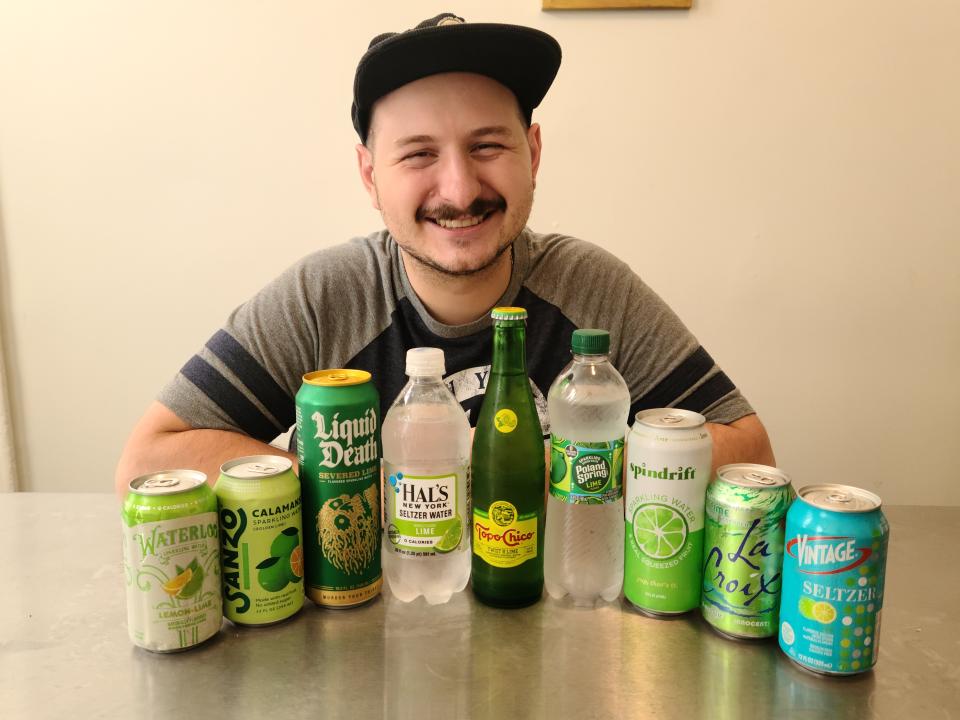 lucien posing with nine brands of lime carbonated water