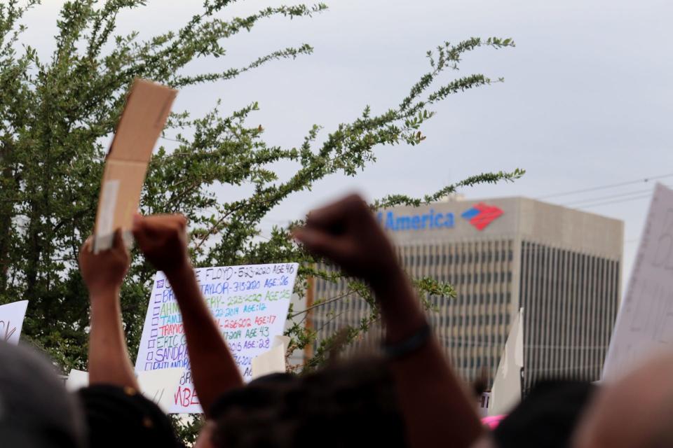 In response to George Floyd's death in police custody, demonstrators raised their fists and chanted in solidarity during a Black Lives Matter march through Las Vegas on May, 30, 2020.