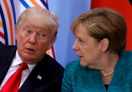 FILE PHOTO: U.S. President Donald Trump and German Chancellor Angela Merkel attend the Women's Entrepreneurship Finance event during the G20 leaders summit in Hamburg, Germany July 8, 2017. REUTERS/Carlos Barria/File Photo