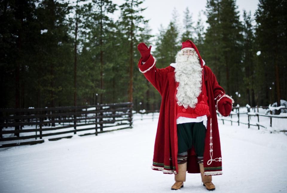 Santa Claus waves outside Rovaniemi, Finnish Lapland on December 15, 2011.