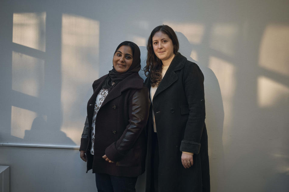 Muslim participant Zubia Naji, left, and her Jewish relative, Erica Spada, right, pose for a picture as they take part at an interfaith workshop on the Israeli-Palestinian conflict at Rutgers University on Sunday, Nov. 19, 2023, in New Brunswick, N.J. The latest violence, triggered by the Oct. 7 Hamas attack on Israel, is prompting some to question such dialogue, its role, impact -- or how to even have it-- while steeling the resolve of others to connect and wrestle together with the challenges. (AP Photo/Andres Kudacki)