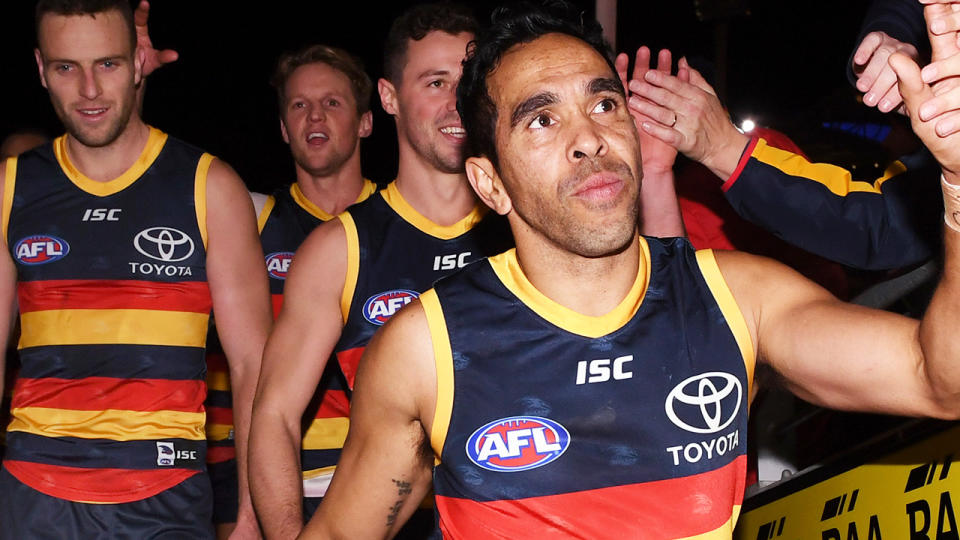 Eddie Betts greets fans as the Adelaide Crows walk off the field.