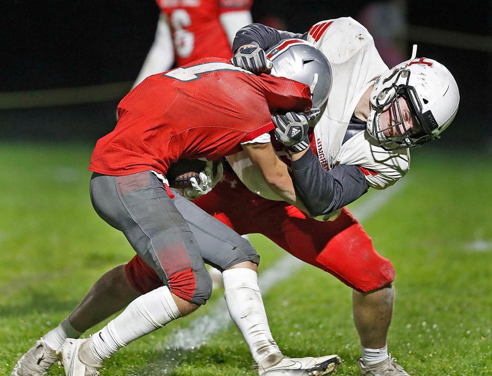 Hingham's Brian Barnard brings down Silver Lake's Logan Barnhart.