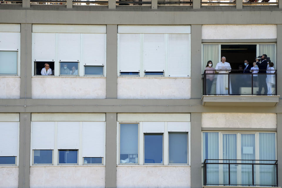 FILE-- In this Sunday, July 11, 2021 file photo, Pope Francis appears on a balcony of the Agostino Gemelli University Polyclinic in Rome, where he was recovering from intestinal surgery, for the traditional Sunday blessing and Angelus prayer. Pope Francis went to the hospital Wednesday, June 7, 2023, to undergo abdominal surgery to treat an intestinal blockage, two years after he had his colon removed 33 centimeters (13 inches) because of inflammation and narrowing of the large intestine. (AP Photo/Alessandra Tarantino)