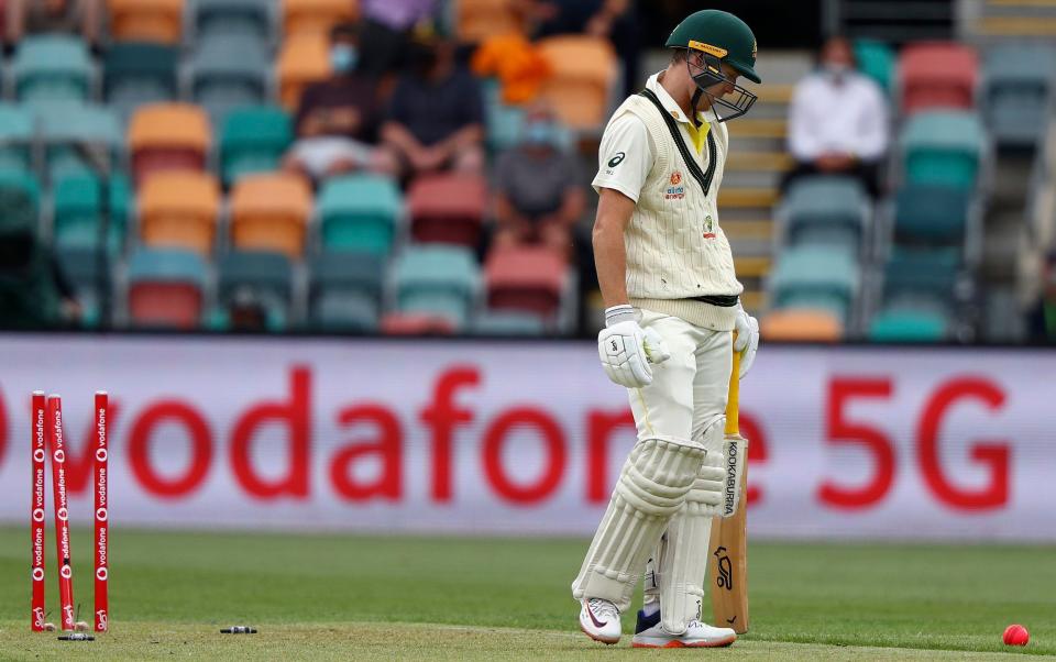 Australia's Marnus Labuschagne looks down after he is bowled by England's Stuart Broad during their Ashes cricket test match in Hobart - AP Photo/Tertius Pickard