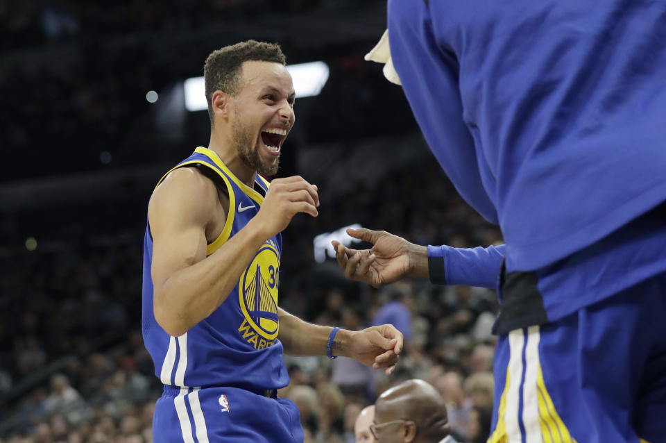 Stephen Curry can’t contain his enthusiasm at finally being famous enough to appear in a tax proposal. (AP)