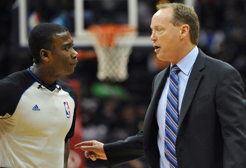 Atlanta Hawks head coach Mike Budenholzer, right, argues a call with referee James Williams in the first half of the NBA basketball game with the Portland Trail Blazers Thursday, March 27, 2014, in Atlanta. (AP Photo/David Tulis)