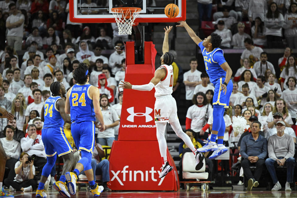 Maryland guard Don Carey (0) goes to the basket for a lay up against UCLA guard Jaylen Clark (0) during the first half of an NCAA college basketball game, Wednesday, Dec. 14, 2022, in College Park, Md. (AP Photo/Terrance Williams)