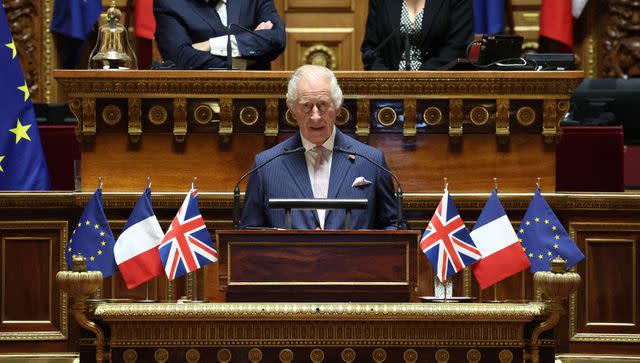 <p>EMMANUEL DUNAND/POOL/AFP via Gett</p> King Charles speaks at the French Senate on Sept. 21