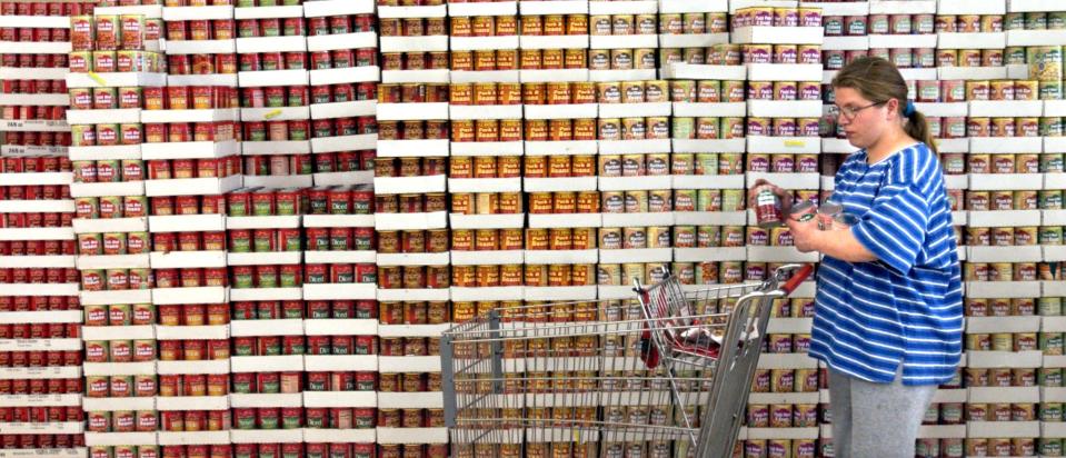 A woman shops for canned goods as a discount grocery in York.