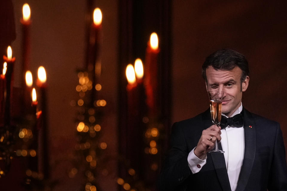 WASHINGTON, DC - DECEMBER 1: French President Emmanuel Macron winks as he shares a toast with U.S. President Joe Biden at the state dinner on the South Lawn of the White House on December 1, 2022 in Washington, DC. President Biden is hosting Macron for the first official state visit of the Biden administration. (Photo by Drew Angerer/Getty Images)
