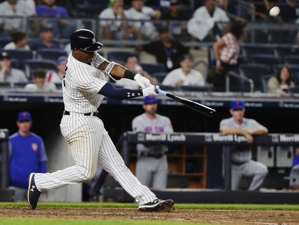 New York Yankees' Miguel Andujar hits a two-run home run during the eighth inning of a baseball game against the New York Mets Monday, Aug. 13, 2018, in New York. (AP Photo/Frank Franklin II)