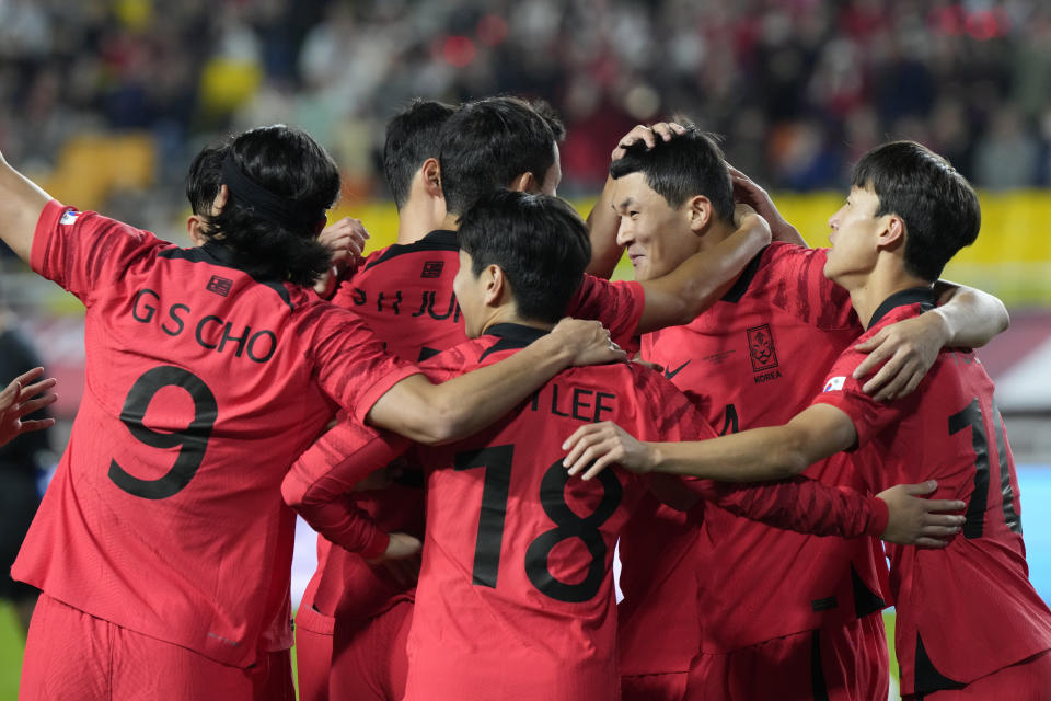 South Korea's Kim Min-jae, second from right, celebrates with his teammates after scoring a goal during an international friendly soccer match between South Korea and Vietnam in Suwon, South Korea, Tuesday, Oct. 17, 2023. (AP Photo/Ahn Young-joon).