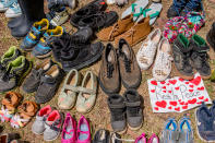 <p>Shoes were laid around the statue of Egerton Ryerson at Ryerson University as a memorial following the discovery of 215 bodies of students from residential schools in Kamloops, British Columbia. (Photo by Shawn Goldberg/SOPA Images/LightRocket via Getty Images)</p> 