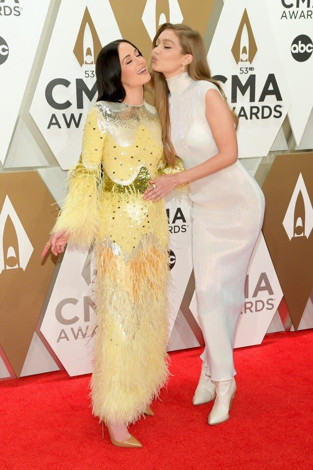 The musician and model are friendship goals on the CMA Awards red carpet.