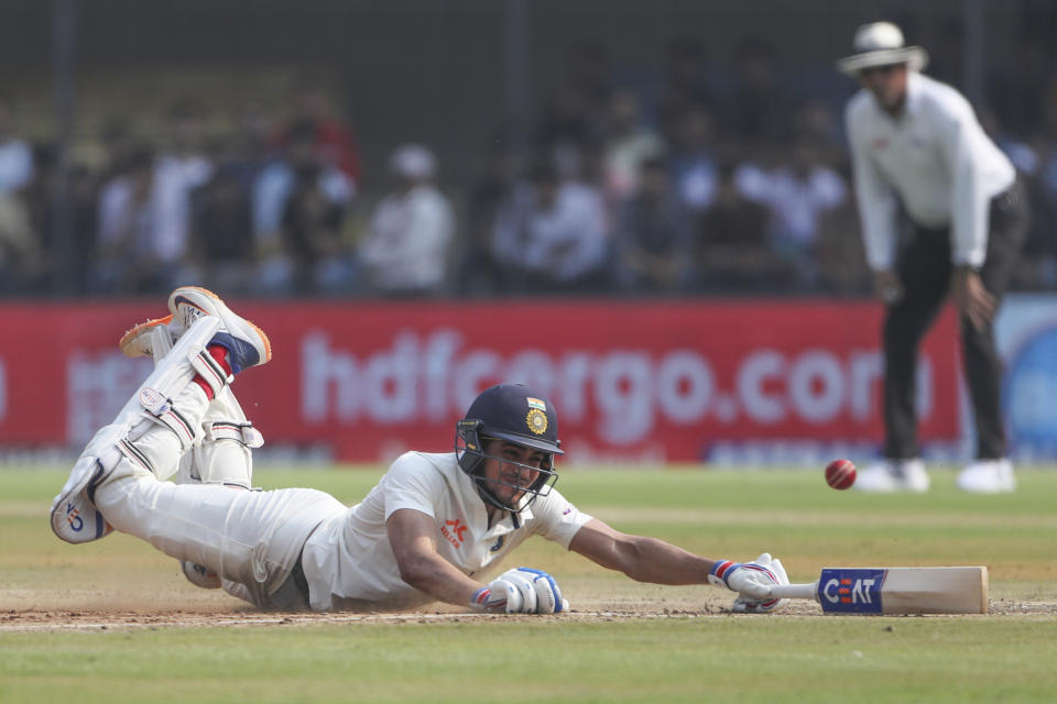 India's Shubmman Gill dives to make it into his crease during the first day of third cricket test match between India and Australia in Indore, India, Wednesday, March 1, 2023. (AP Photo/Surjeet Yadav)