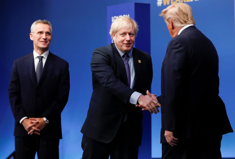 NATO Secretary General Jens Stoltenberg and Britain's Prime Minister Boris Johnson greet U.S. President Donald Trump at the annual NATO heads of government summit at the Grove hotel in Watford