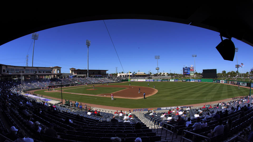 Fans watch a spring training baseball game between the Philadelphia Phillies and the New York Yankees in Clearwater, Fla., Thursday, March 4, 2021. (AP Photo/Gene J. Puskar)