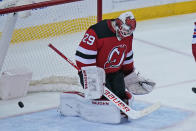 New Jersey Devils goaltender Mackenzie Blackwood reacts after being scored on during the second period of the NHL hockey game against the New York Rangers in Newark, N.J., Sunday, April 18, 2021. (AP Photo/Seth Wenig)