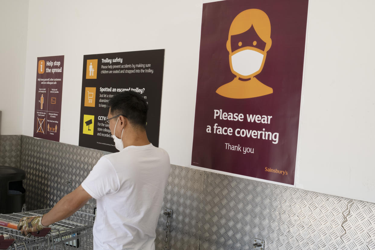 With most shops now open but with retail sales suffering due to the Coronavirus pandemic, shoppers wearing face maks at Sainsbury's supermarket, which became compulsory in shops on the 24th July, out shopping on Kings Heath High Street on 31st July 2020 in Birmingham, United Kingdom. Coronavirus or Covid-19 is a respiratory illness that has not previously been seen in humans. While much or Europe has been placed into lockdown, the UK government has put in place more stringent rules as part of their long term strategy, and in particular social distancing. (photo by Mike Kemp/In PIctures via Getty Images)