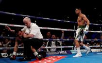 Amir Khan defeats Phil Lo Greco by TKO inside 40 seconds on return to the ring