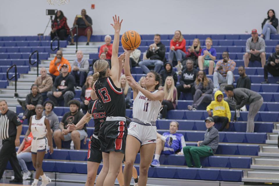 The ECS girls basketball team traveled to Naples to play Aubrey Rogers on Monday, Dec. 11, 2023. Aubrey Rogers' Samantha Mey tries a shot over Hayden Hendrix.