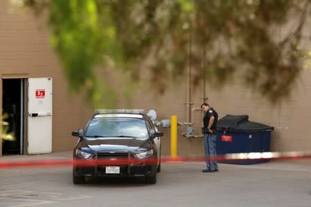 A police officer is seen after a mass shooting at a Walmart in El Paso