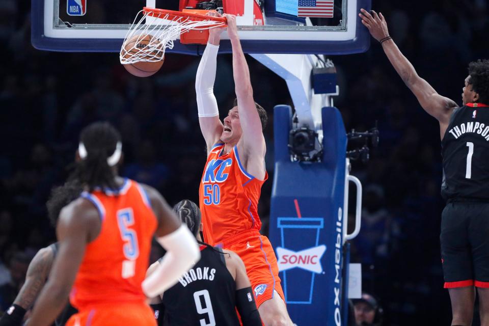 Oklahoma City center Mike Muscala dunks the ball against Houston on March 27 at Paycom Center.