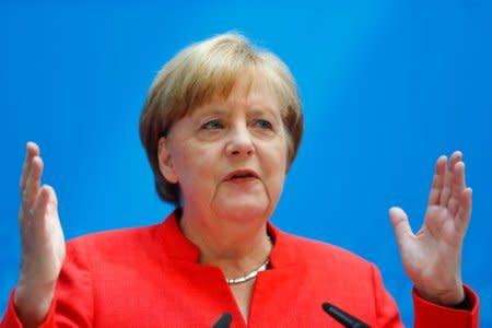 FILE PHOTO: German Chancellor Angela Merkel gestures as she attends a press conference after the board meeting of Germany's Christian Democratic Union (CDU) in Berlin, Germany, June 18, 2018. REUTERS/Hannibal Hanschke