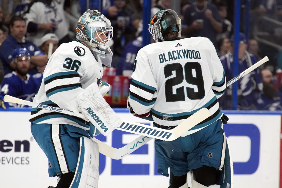San Jose Sharks' Kaapo Kahkonen (36) replaces Mackenzie Blackwood (29) in goal against the Tampa Bay Lightning during the second period of an NHL hockey game Thursday, Oct. 26, 2023, in Tampa, Fla. (AP Photo/Chris O'Meara)