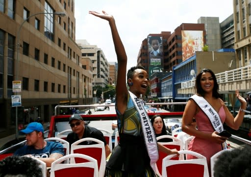 Miss Universe, Zozibini Tunzi (L) waved to crowds who came out to greet her and celebrate her victory