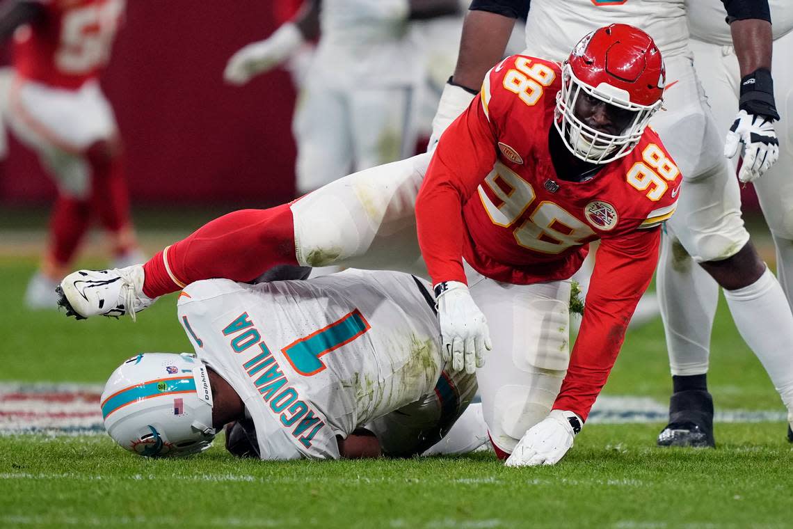 Miami Dolphins quarterback Tua Tagovailoa (1) is sacked for an 11-yard loss by Kansas City Chiefs defensive tackle Tershawn Wharton (98) during the second half of an NFL football game Sunday, Nov. 5, 2023, in Frankfurt, Germany. (AP Photo/Martin Meissner) Martin Meissner/AP