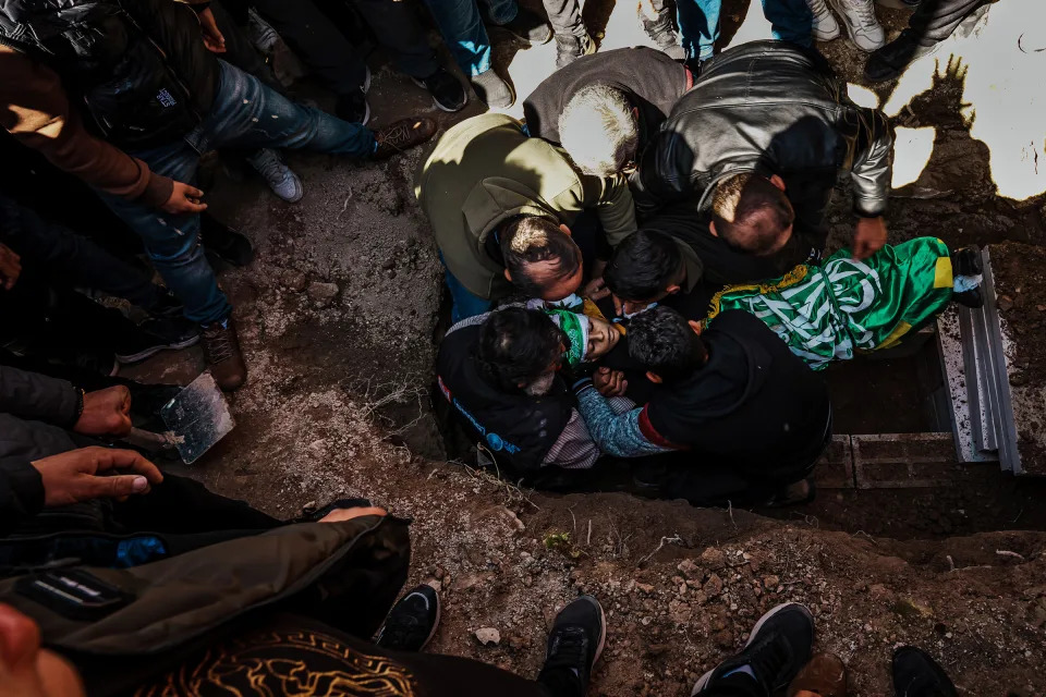 Family members bury Amro Najjar, 10, a burial at the local cemetery in Burin, West Bank, March 5, 2024. The boy was killed by Israeli forces during an incursion the day before.<span class="copyright">Marcus Yam—Los Angeles Times/Getty Images</span>