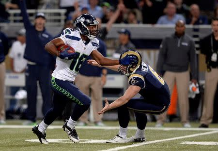 Sep 13, 2015; St. Louis, MO, USA; Seattle Seahawks wide receiver Tyler Lockett (16) rushes past St. Louis Rams punter Johnny Hekker (6) and scores a 57 yard touchdown during the first half at the Edward Jones Dome. Mandatory Credit: Jeff Curry-USA TODAY Sports