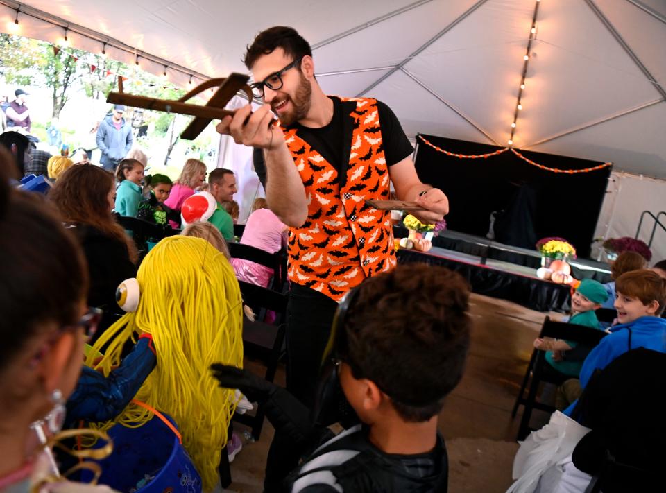 Marionettist Josh Eguia interacts with his young audience Saturday at the Abilene Zoo as part of the Spooky Strings show in which he performs with partner Bridget Andersen, Oct. 28, 2023. This was the final weekend for Boo at the Zoo.