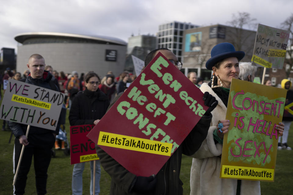 Hundreds of people protested in Amsterdam, Netherlands, Saturday, Jan. 29, 2022, in a #MeToo demonstration sparked by allegations of sexual improprieties linked to a popular Dutch TV talent show. The demonstration on Amsterdam's Museumplein square was organized following reports of inappropriate sexual behavior, ranging from WhatsApp messages to an allegation of rape, linked to "The Voice of Holland." (AP Photo/Peter Dejong)