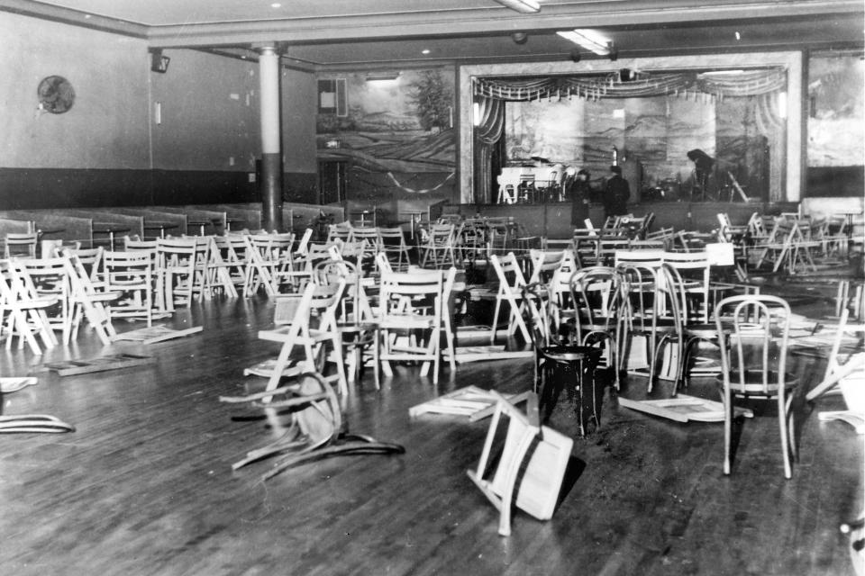 FILE — This photo shows the Audubon ballroom, in New York's Harlem neighborhood, after it was roped off by police following the assassination of Malcolm X, February 21, 1965. Two of the three men convicted in the assassination of Malcolm X are set to be cleared Thursday, Nov. 18, 2021, after insisting on their innocence since the 1965 killing of one of the United States' most formidable fighters for civil rights, Manhattan's top prosecutor said Wednesday, Nov. 17, 2021. (AP Photo/Al Burleigh, File)