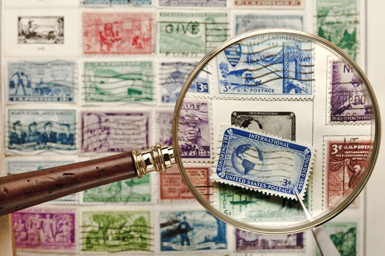 stamp collection with magnifying glass