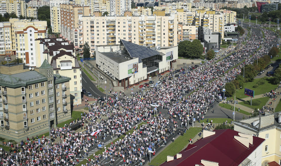 Protesters march during an opposition supporters rally in Minsk, Belarus, Sunday, Sept. 13, 2020. Protests calling for the Belarusian president's resignation have broken out daily since the Aug. 9 presidential election that officials say handed him a sixth term in office. (Tut.by via AP)