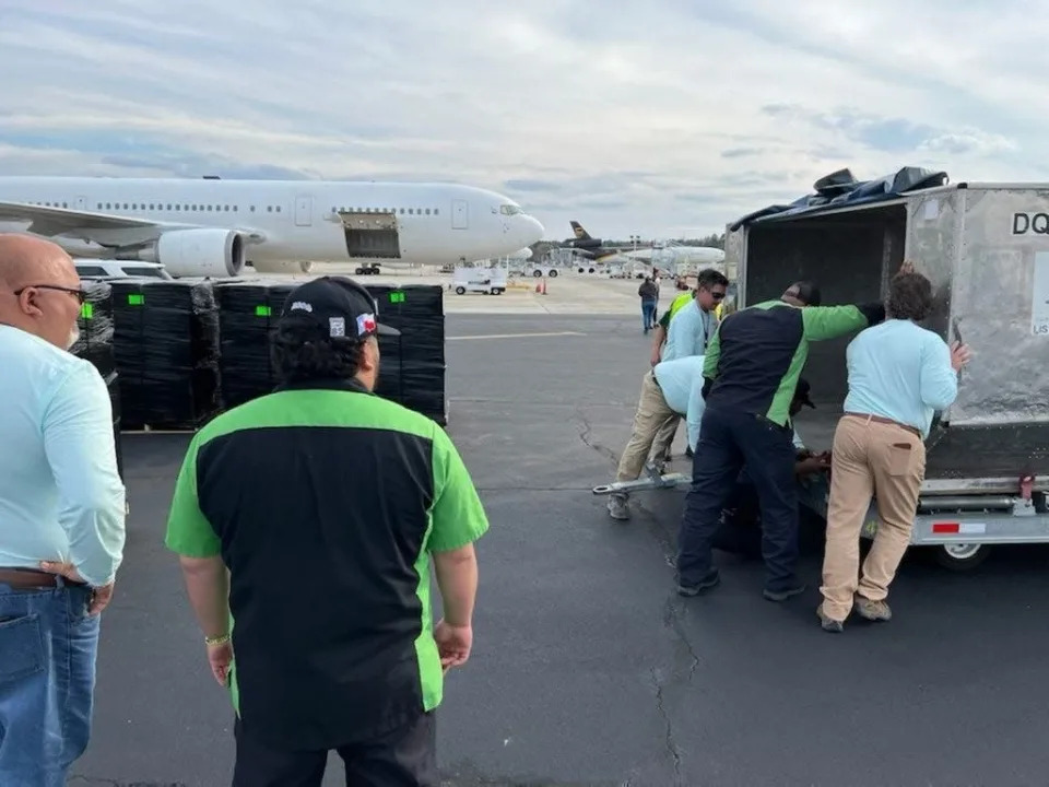 Private Jet Services humanitarian relief for Ukraine. Pictured are airport staff loading cargo.