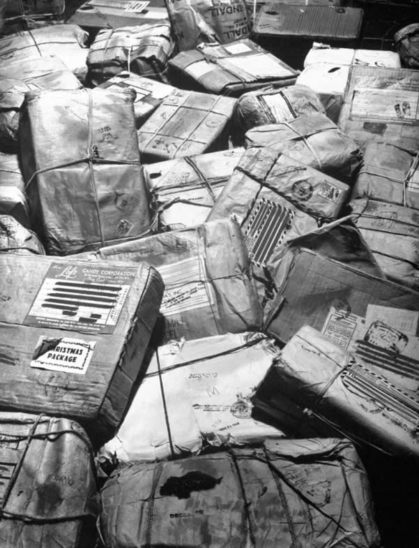 In New York City, piles of Christmas packages meant for American servicemen who have been listed as missing or killed in action await "return to sender" stamp, 1944. (Frank Scherschel—Time & Life Pictures/Getty Images) <br> <br> <a href="http://life.time.com/history/the-postal-service-classic-photos/#1" rel="nofollow noopener" target="_blank" data-ylk="slk:Click here to see the full collection at LIFE.com;elm:context_link;itc:0;sec:content-canvas" class="link ">Click here to see the full collection at LIFE.com</a>