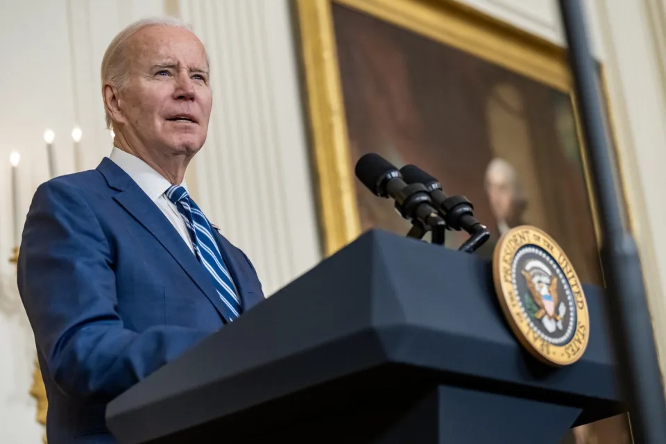 President Joe Biden standing at a podium.