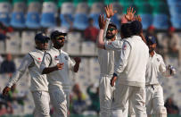 Cricket - India v England - Third Test cricket match - Punjab Cricket Association Stadium, Mohali, India - 26/11/16. Indian players celebrate the dismissal of England's Haseeb Hameed. REUTERS/Adnan Abidi