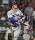 New York Mets' Mark Canha watches his two-run home run against the Atlanta Braves during the fifth inning of a baseball game Thursday, Aug. 18, 2022, in Atlanta. (Curtis Compton/Atlanta Journal-Constitution via AP)