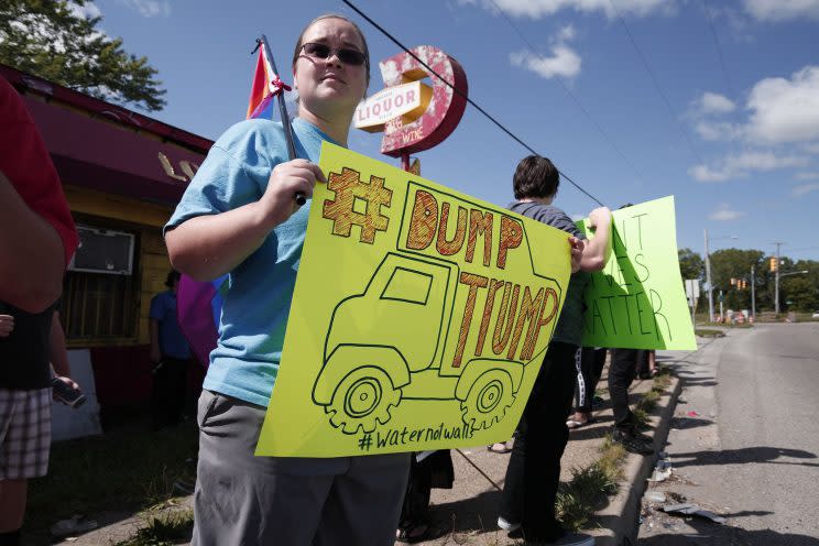 An anti-Trump protestor waits for the Republican presidential nominee to arrive at the Flint Water Treatment Plant on September 14, 2016 (Photo: Bill Pugliano/Getty Images)