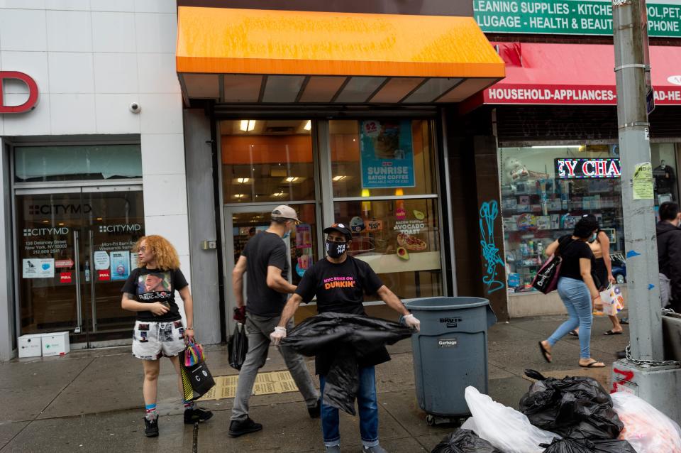 People moving on a busy sidewalk.