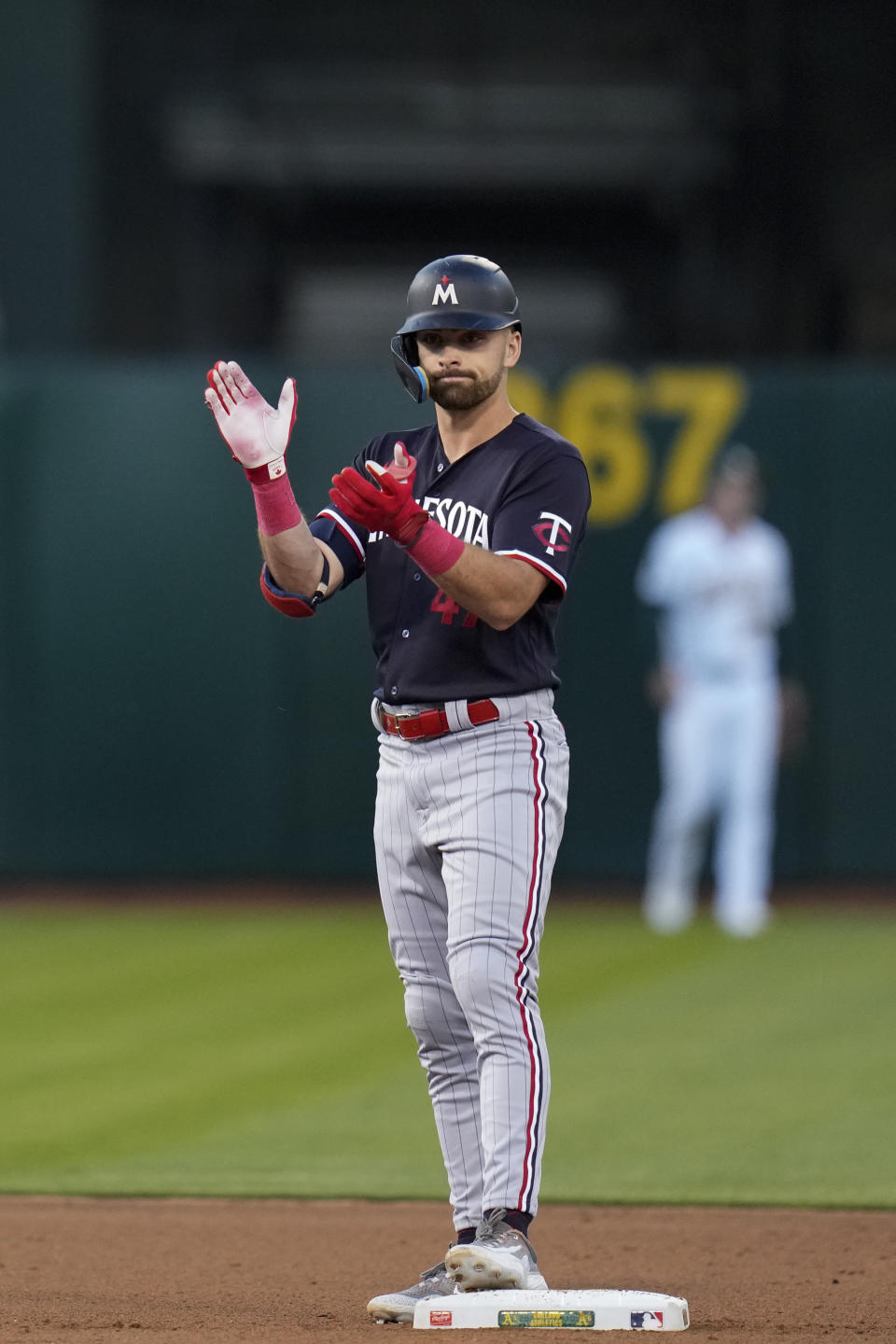 Minnesota Twins' Edouard Julien reacts after hitting an RBI double against the Oakland Athletics during the fourth inning of a baseball game Friday, July 14, 2023, in Oakland, Calif. (AP Photo/Godofredo A. Vásquez)