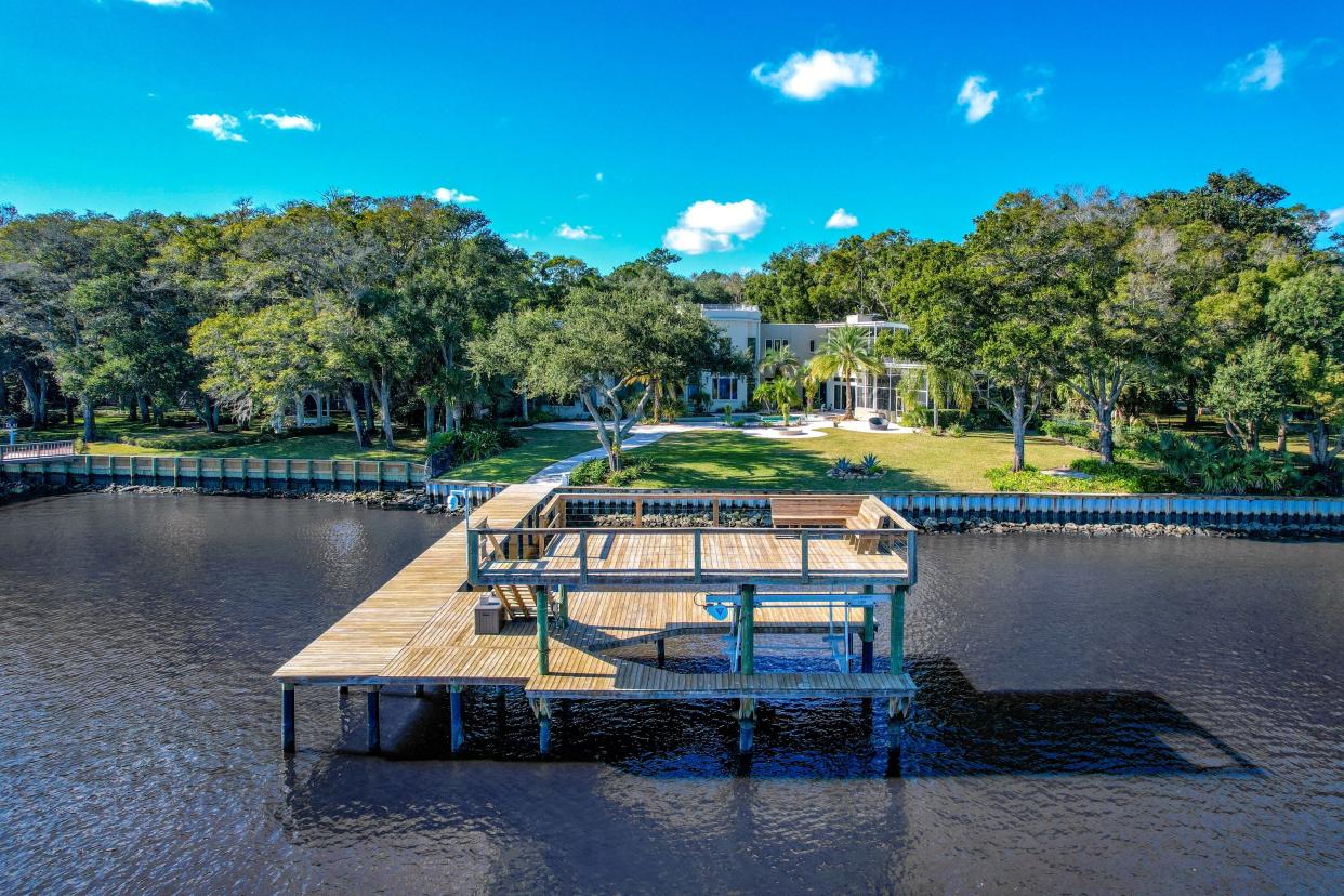 A view from the Intracoastal Waterway of 5147 Dixie Landing Drive, complete with private dock and boat lift.