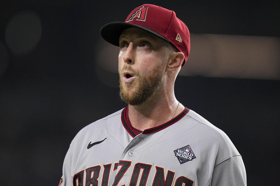 Arizona Diamondbacks starting pitcher Merrill Kelly reacts to the end of the sixth inning in Game 2 of the baseball World Series against the Texas Rangers Saturday, Oct. 28, 2023, in Arlington, Texas. (AP Photo/Brynn Anderson)